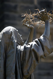 St. Catherine of Siena holding up a crown of thorns